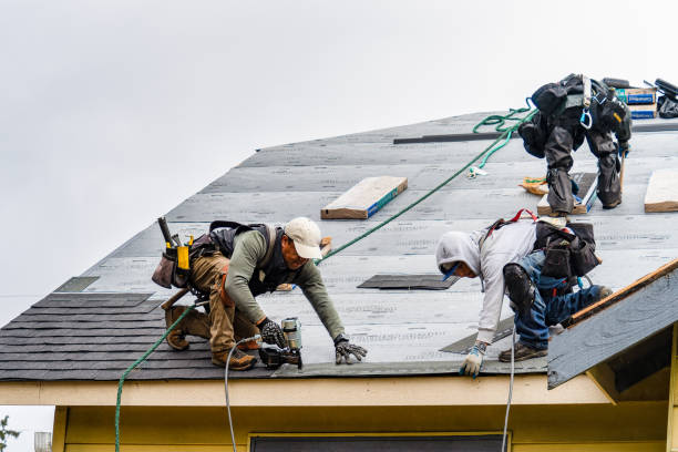 Professional Gutter Installation technician working in Kensington, KS